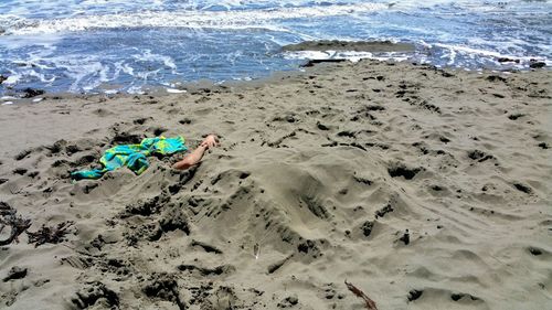 High angle view of man in sand at beach