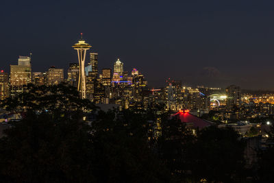 Illuminated buildings in city at night