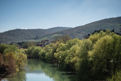 Scenic view of lake with mountains in background