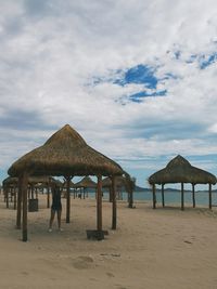 Built structure on beach against sky