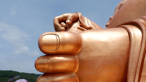 Close-up of statue against sky