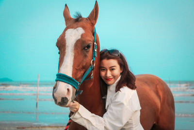 Portrait of woman with horse