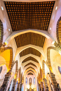 Low angle view of illuminated ceiling in building