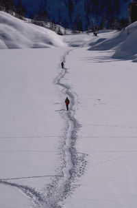 Person skiing on snow covered field