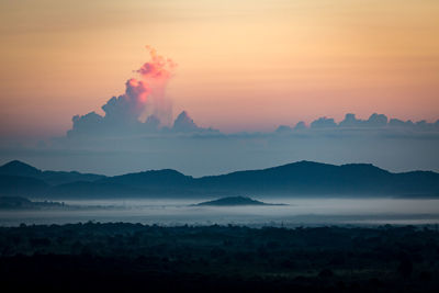 Scenic view of mountains against sky during sunset