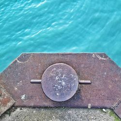 High angle view of metal by swimming pool