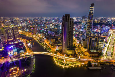 High angle view of illuminated city buildings at night