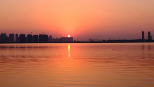 Scenic view of sunset over river