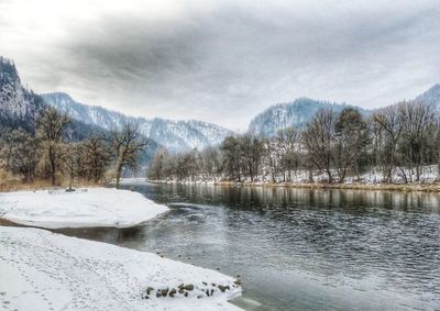 Scenic view of frozen lake against sky