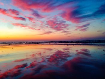 Scenic view of lake against sky at sunset