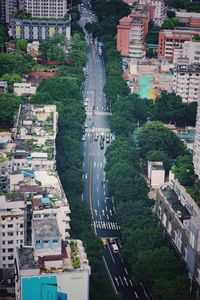 High angle view of buildings and trees in city