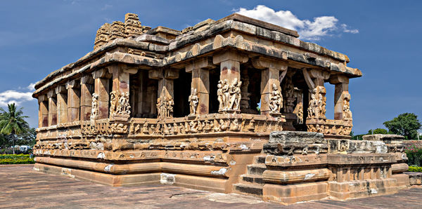 Entrance of durga temple with blue sky and clouds, aihole, bagalkot, karnataka, india.