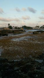 Scenic view of sea against cloudy sky