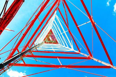 Directly below shot of communication tower against sky