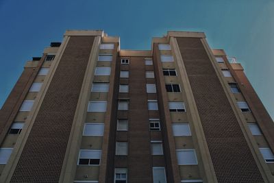 Low angle view of office buildings against sky