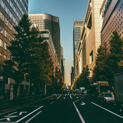 Road in city against clear sky
