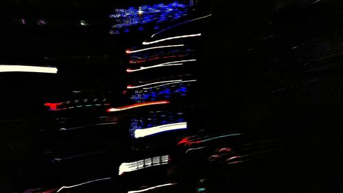 Low angle view of illuminated building at night