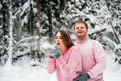 Portrait of woman with ice cream in winter