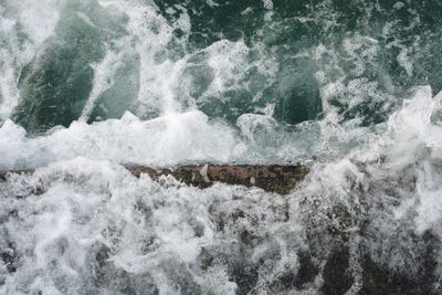 View of waves splashing on rocks