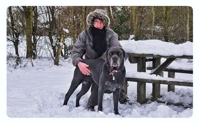 Person standing on snow covered field