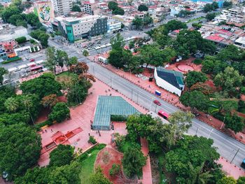 High angle view of buildings and trees in city