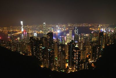 High angle view of illuminated cityscape seen from victoria peak at night