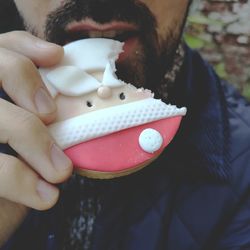 Close-up of hand holding ice cream