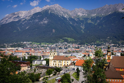 High angle view of townscape and mountains against sky