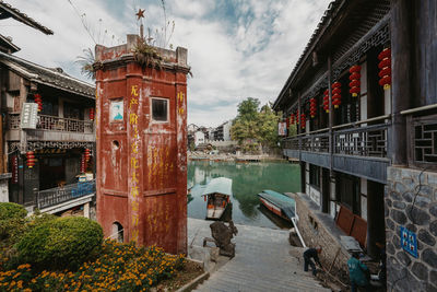 Canal amidst buildings in city