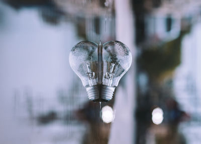 Close-up of light bulb in frozen lake