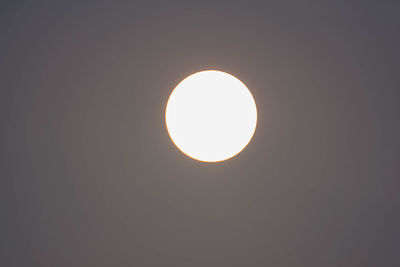 Low angle view of illuminated lighting equipment against sky