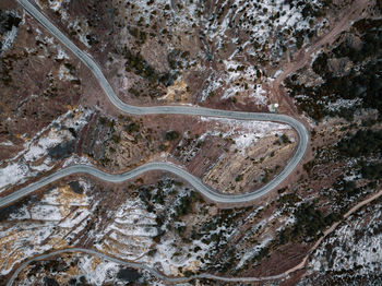 High angle view of winding road on land