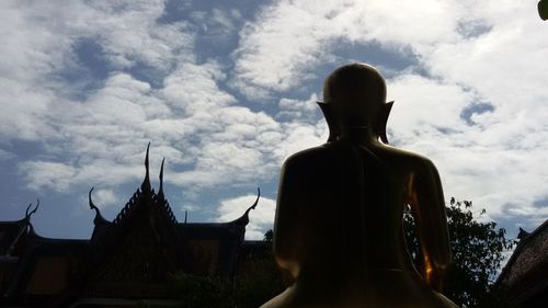 Low angle view of statue against cloudy sky