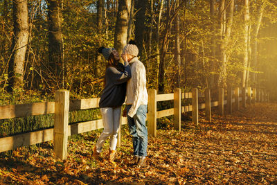 Romantic couple in forest during autumn