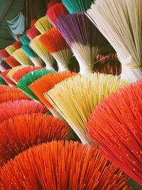 High angle view of multi colored incense sticks for sale