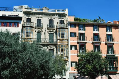 Low angle view of building against clear blue sky