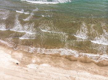 High angle view of surf on beach