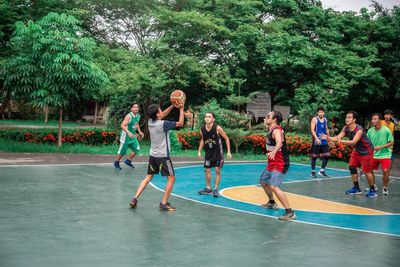 Group of people playing on plants