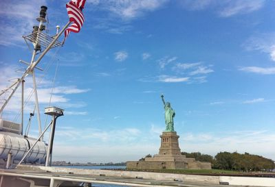Low angle view of statue against cloudy sky