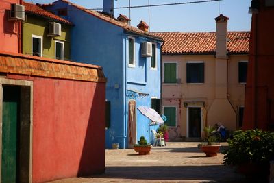 Houses in town against sky