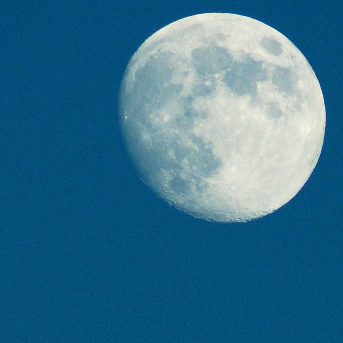 moon, sphere, astronomy, low angle view, blue, copy space, moon surface, circle, planetary moon, full moon, space exploration, discovery, clear sky, sky, beauty in nature, night, nature, tranquility, scenics, majestic