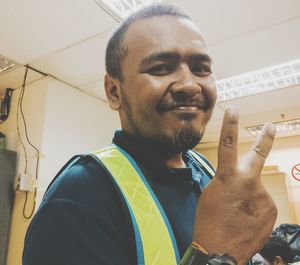 Portrait of smiling man smoking