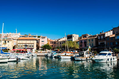 Boats moored at harbor