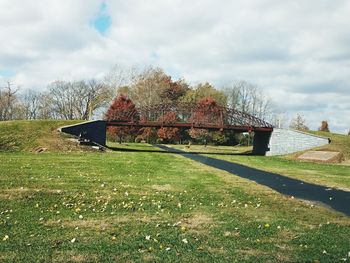 Built structure on field against sky