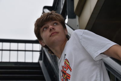 Portrait of young man in stairwell 