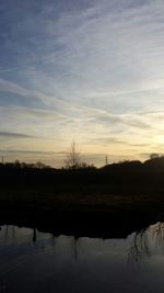 Scenic view of landscape against cloudy sky