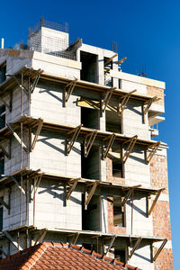 Low angle view of buildings against clear sky