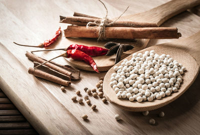 High angle view of various spices on cutting board