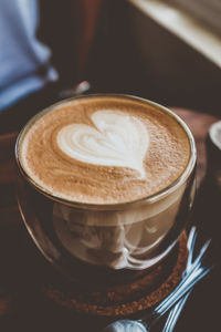 Close-up of cappuccino on table