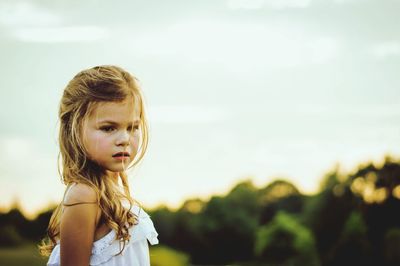 Beautiful girl against sky